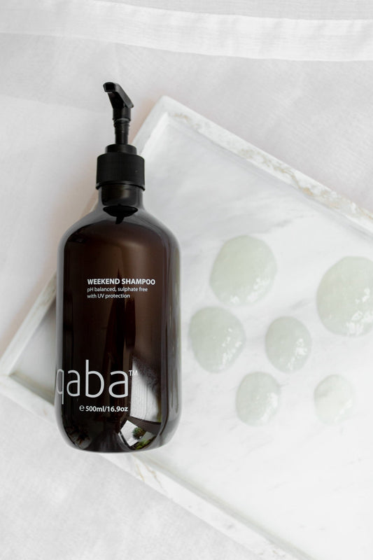 qaba sulfate-free shampoo bottle on display, highlighting a pH-balanced formula with UV protection, ideal for gentle cleansing without stripping natural oils.